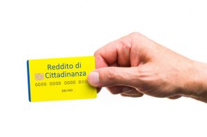 Citizenship income, hand with credit card. grant from the Italian state