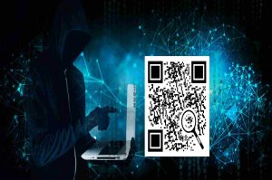QR code and hacker with laptop